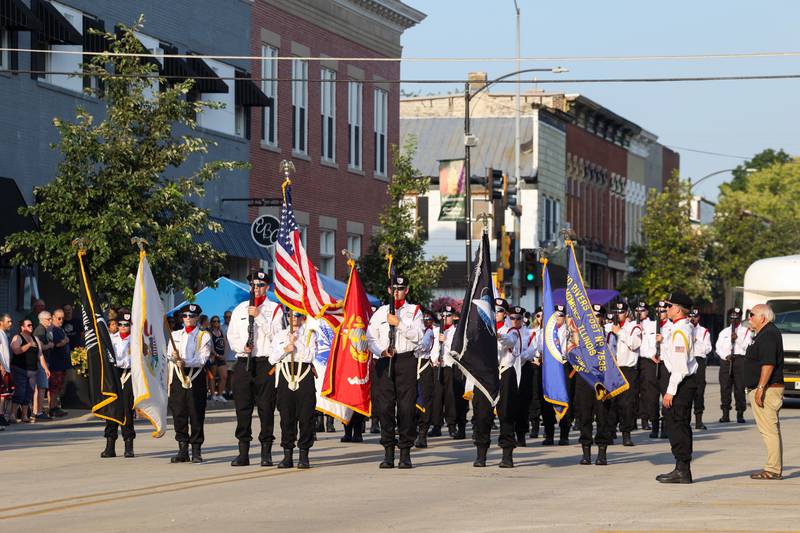 The Momence Honor Guard stands at attention for the national anthem to kick off the 87th Momence Gladiolus Festival Main Street Parade on Friday, Aug. 8, 2025.
