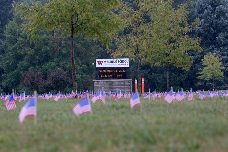 Waltham School placed 2,977 flags outside the school lawn to remember the lives lost in the 9/11 attacks on Monday, Sept. 11, 2023 in Utica.