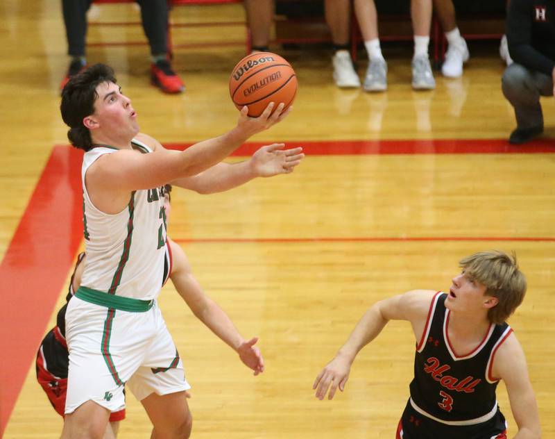 L-P's Josh Senica does a reverse layup over Hall's Max Bryant on Tuesday, Nov. 28, 2023 in AJ Sellett Gymnasium at L-P High School.