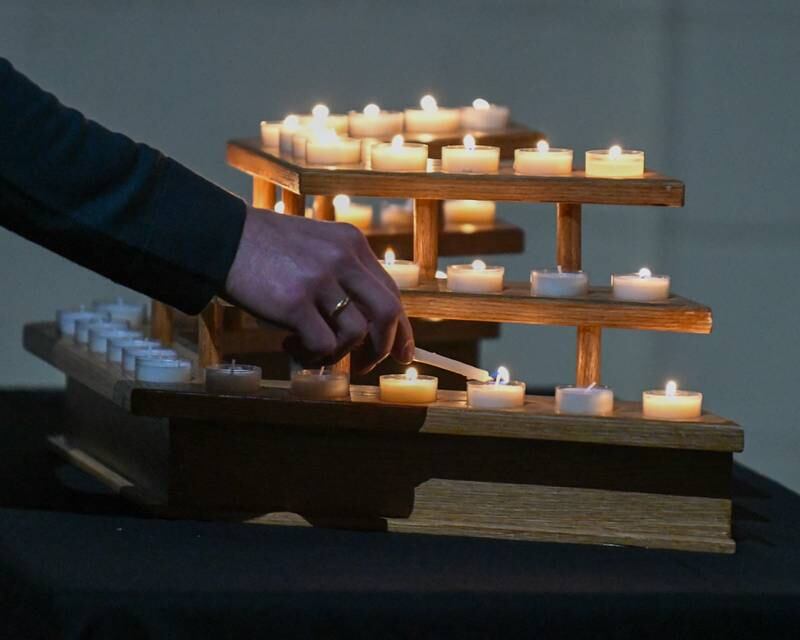 Prayer candles were lit during a vigil for peace in Israel and Palestine on Tuesday, Nov. 21, 2023, held at the First Congregational United Church of Christ in DeKalb.