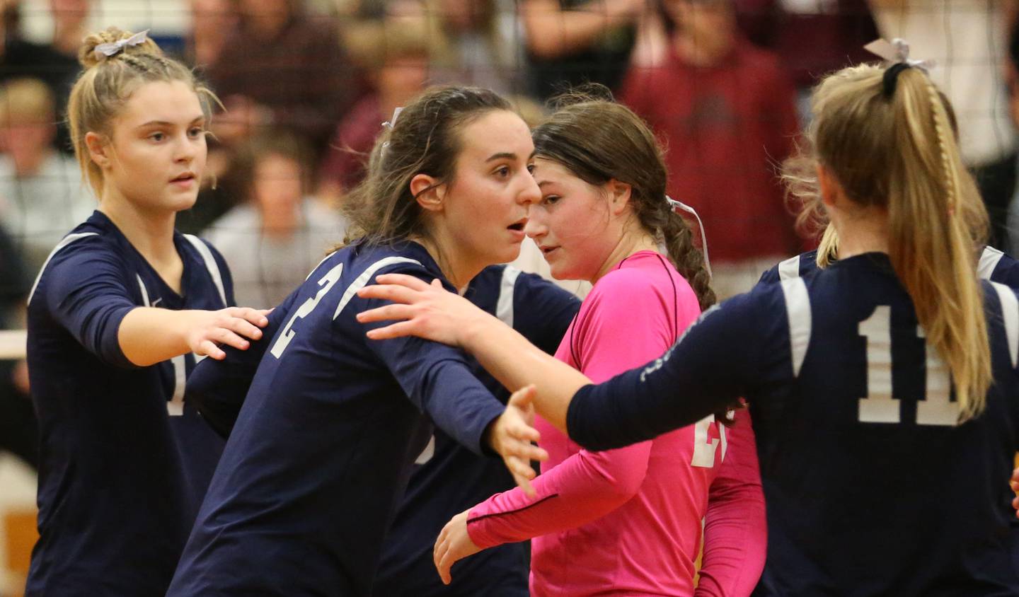 Fieldcrest's Ashlyn May (center) huddles with her teammates Kaylin Rients, Carolyn Megrow, and Allie Wiesenhofer after loosing to IVC in the Class 2A Sectional volleyball final at Prairie Central High School on Wednesday, Nov. 2, 2022 in Fairbury.