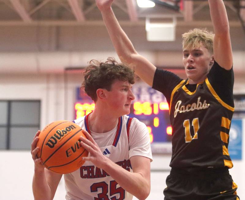 Jacobs’ Carson Goehring, right, defends Dundee-Crown’s Hudson Reardon in varsity boys basketball on Friday, Dec. 12, 2025, at Dundee-Crown High School in Carpentersville.