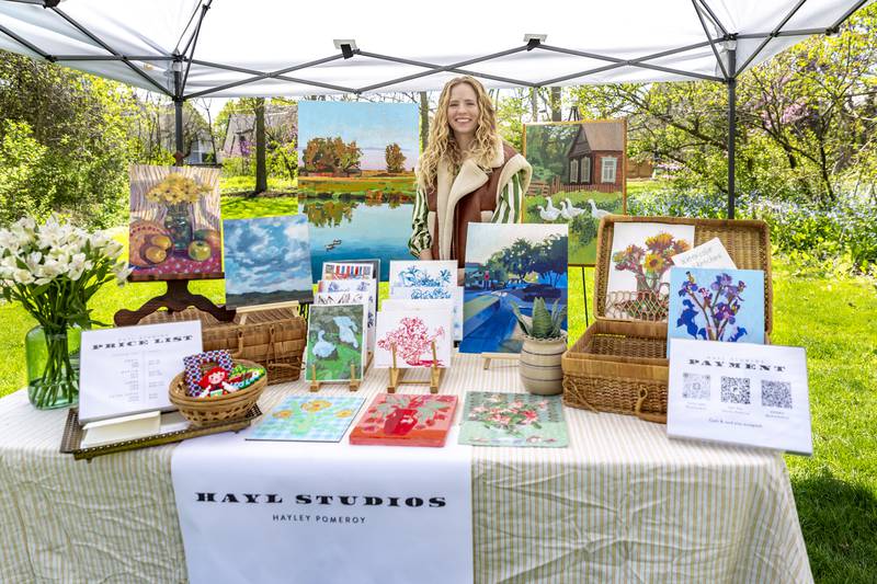 Haley Pomeroy shows off her art at the Downers Grove Park District Country in the Park on Saturday, May 3, 2025  in Downers Grove.