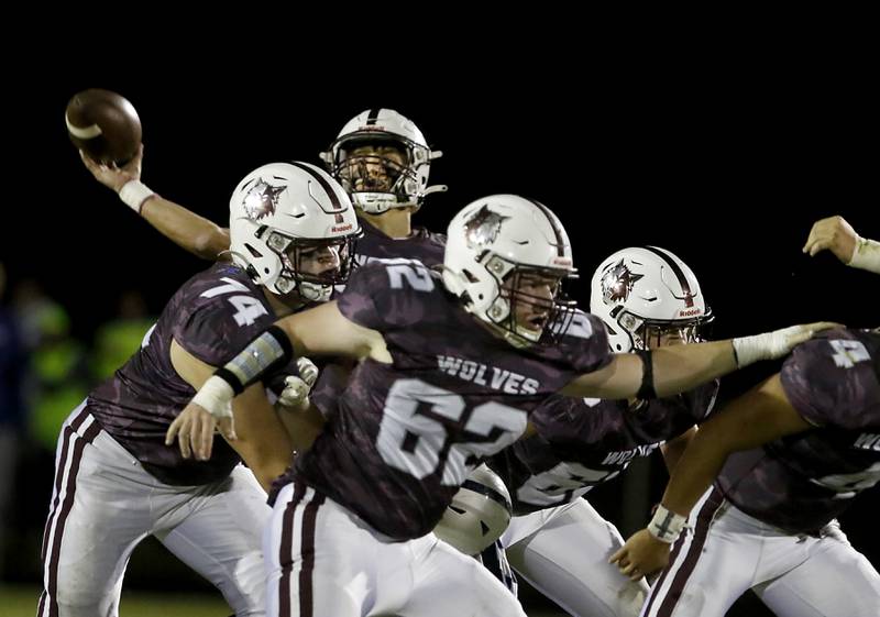 Prairie Ridge's Tyler Vasey throws a pass as he is protected by his teammates during a Fox Valley Conference football game between Prairie Ridge  and Cary-Grove Friday, Sept. 23, 2022, at Prairie Ridge High School in Crystal Lake.