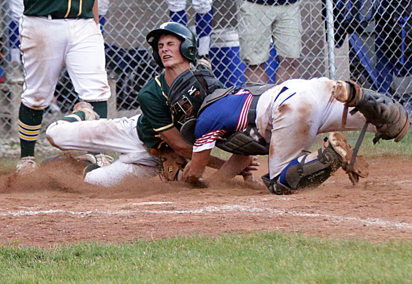 Newark's Lucas Pasakarnis tags out Grant Park’s Wesley Schneider at the plate in a 2021 sectional title game in Newark.