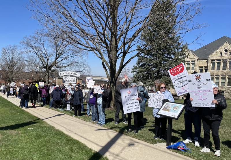 People line up along City Square in downtown Lockport for a No Kings protest on Saturday, March 28, 2026.  More than 200 people attended the event.