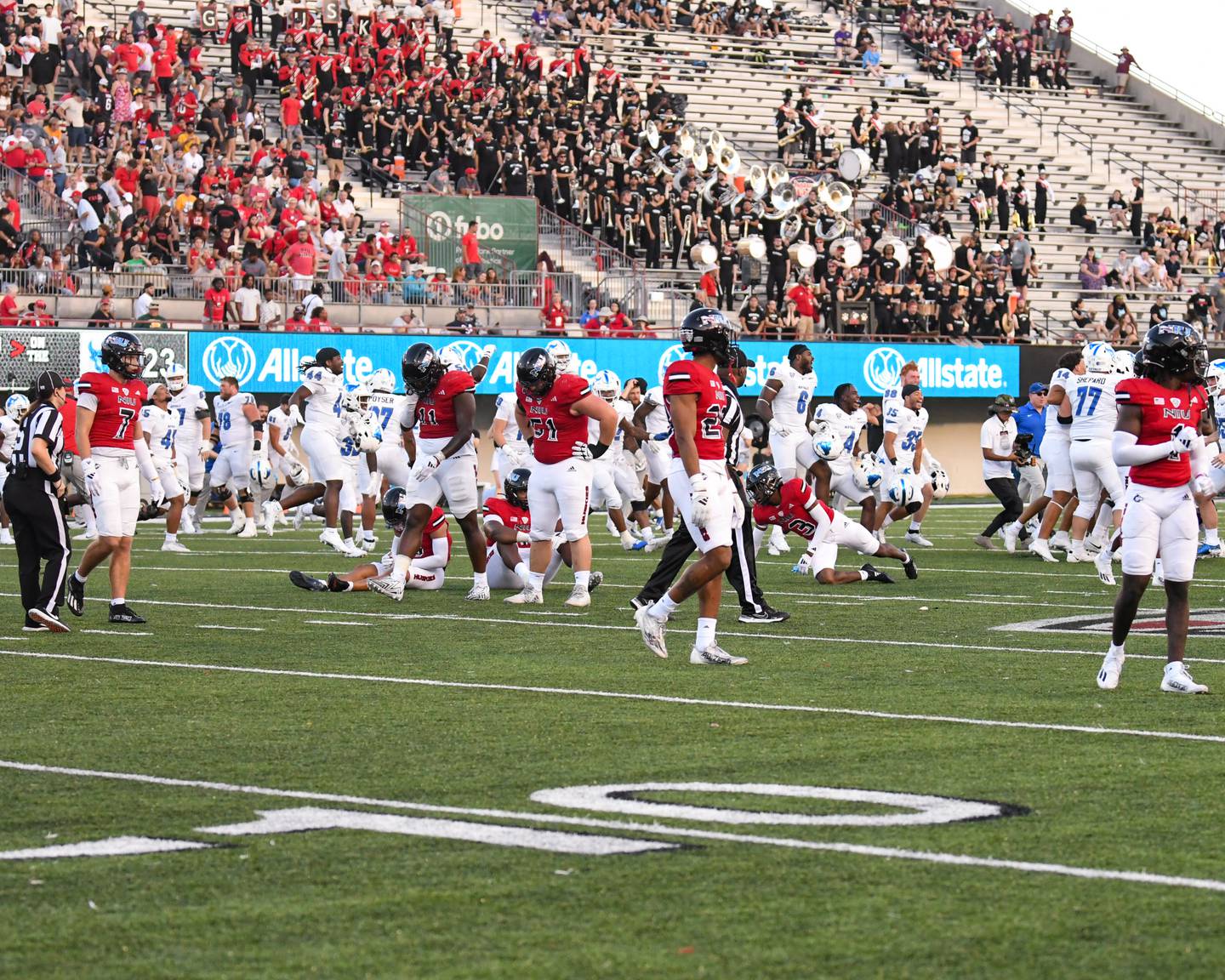 Northern Illinois football team stop and reflect for a moment after losing their first game of the season on Saturday Sept. 21, 2024, while taking on Buffalo at Huskie Stadium in DeKalb.