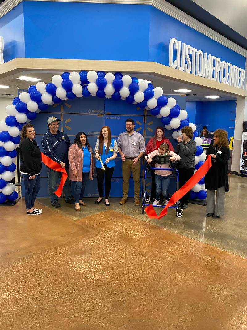 After a 12-week remodel, the Peru Walmart recently cut a ribbon dedicating its renovation with Peru Mayor Ken Kolowski (second from left) and Illinois Valley Area Chamber of Commerce.