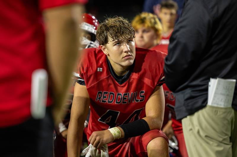 Chace Sterling (44) of Hall listens to postgame meeting after loss on Friday, Sept 5, 2025 at Richard Nesti Stadium in Spring Valley.