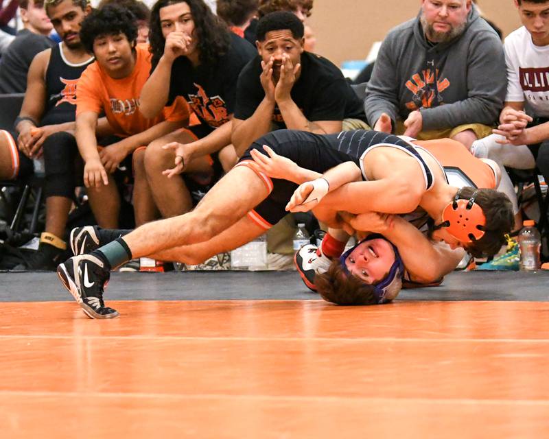 DeKalb’s wrestler Kaden Klapprodt pins St. Charles East Liam Aye during the first round in the 113 weight class held on Friday Dec. 30th during The Don Flavin wrestling Invite held at DeKalb High School.