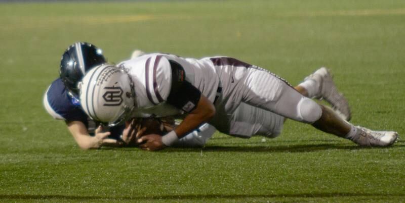 Wheaton Academy's Ethan Brunner recovers a fumble during their game against Immaculate Conception Friday Sept 30, 2022.