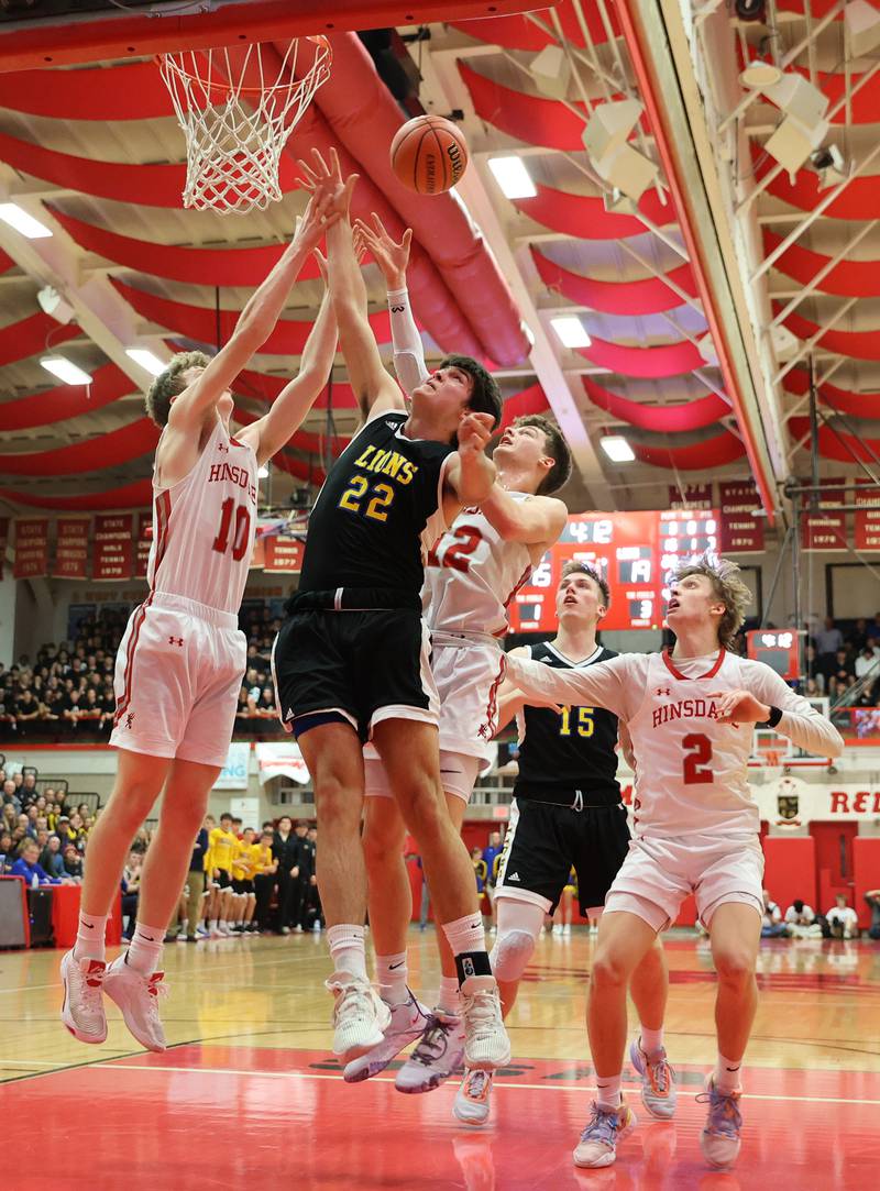 Hinsdale Central and Lyons fight for a rebound during the boys 4A varsity sectional semi-final game between Hinsdale Central and Lyons Township high schools in Hinsdale on Wednesday, March 1, 2023.