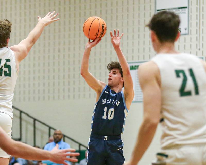 Nazareth's Jack Ariens (10) shoots a jumper during their Jack Tosh Holiday Classic basketball tournament game between Nazareth vs Glenbard West. Thursday Dec 26, 2024 in Elmhurst.