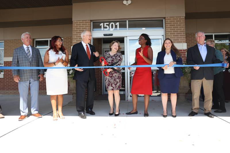 VNA Health Care President and CEO Linnea Windel stands with State and local official for the ribbon cutting at the new VNA Health Care facility on Tuesday, Sept. 5, 2023 in Joliet.