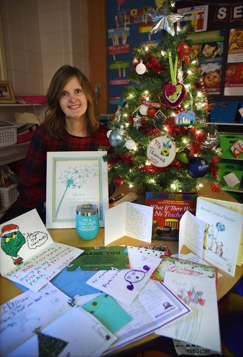 Allison Thomas has kept many of the handwritten notes her third-grade students at Davis Primary School in St. Charles have given her through the years. John Starks | Daily Herald Media Group