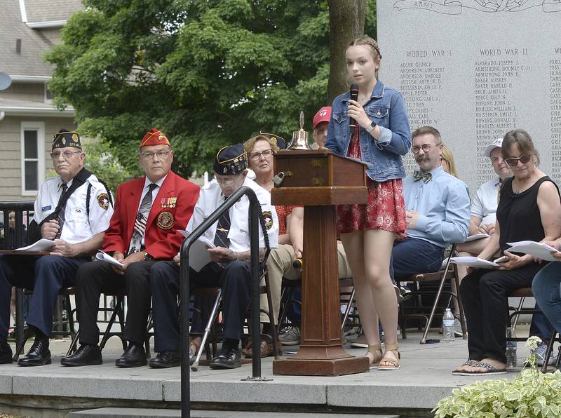 Marquette Academy freshman Ava Offerman reads her winning essay “Who Are Our Modern Day Patriots” on Monday, May 29, 2023, in Ottawa during the Memorial Day ceremony.