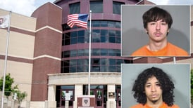 2 jailed after man allegedly pointed gun at person off Woodstock Square; other accused of hiding weapon 