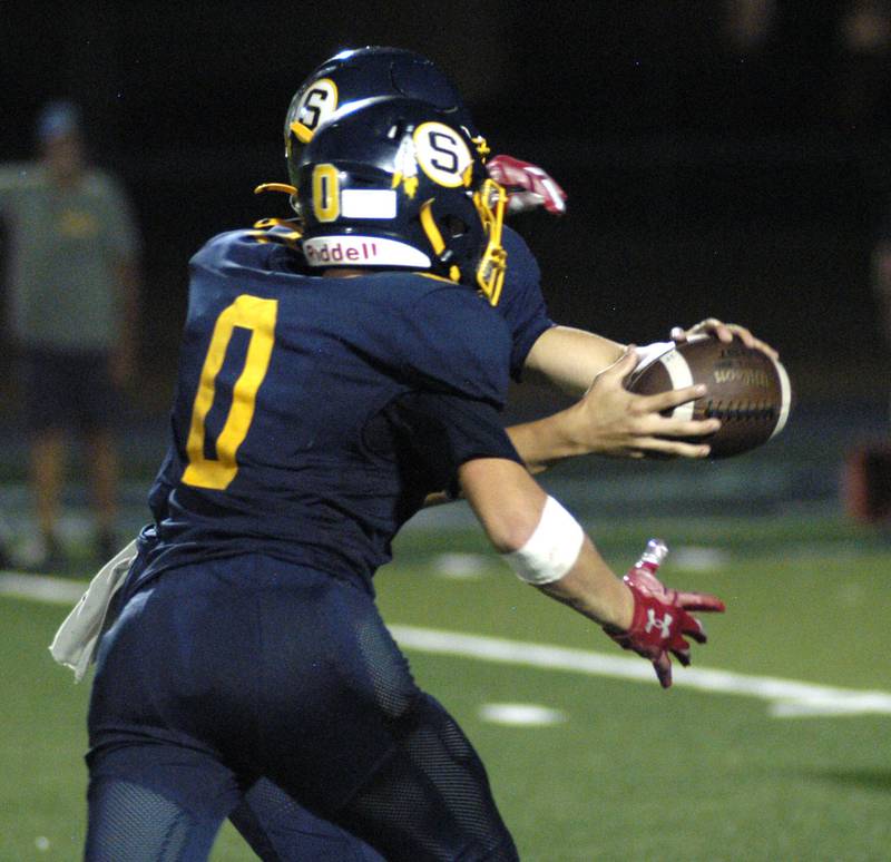 Wyatt Cassens takes a handoff. The Galesburg Silver Streaks traveled to Sterling to take on the Warriors at Prescott Memorial Field at Roscoe Eades Stadium, September 26, 2025.