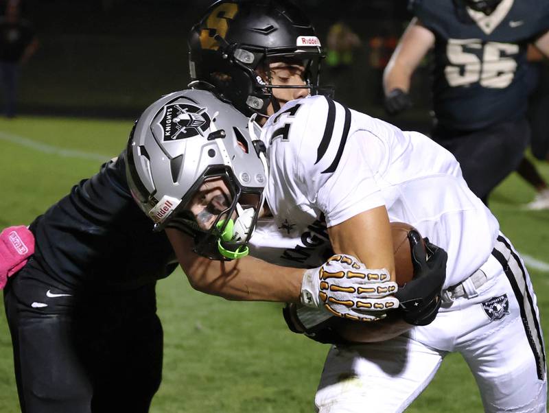 Kaneland's Brady Brown tries to push Sycamore's Josiah Mitchell for a couple extra yards during their game Friday, Oct. 3, 2025, at Sycamore High School.