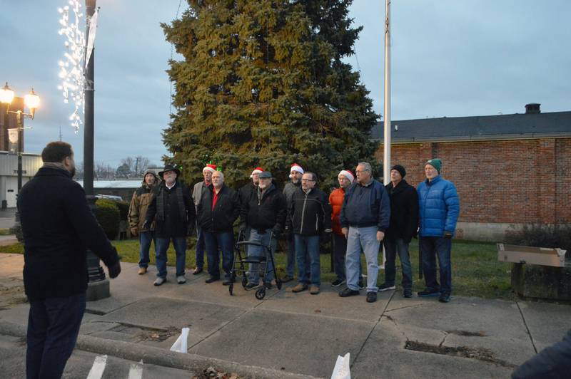The Rock River Valley Barbershop Chorus sings at Paul's Park in Polo, in front of the yet-to-be-lit Christmas tree on Saturday, Dec. 2, 2023, during the fifth annual Polo Christmas Festival.