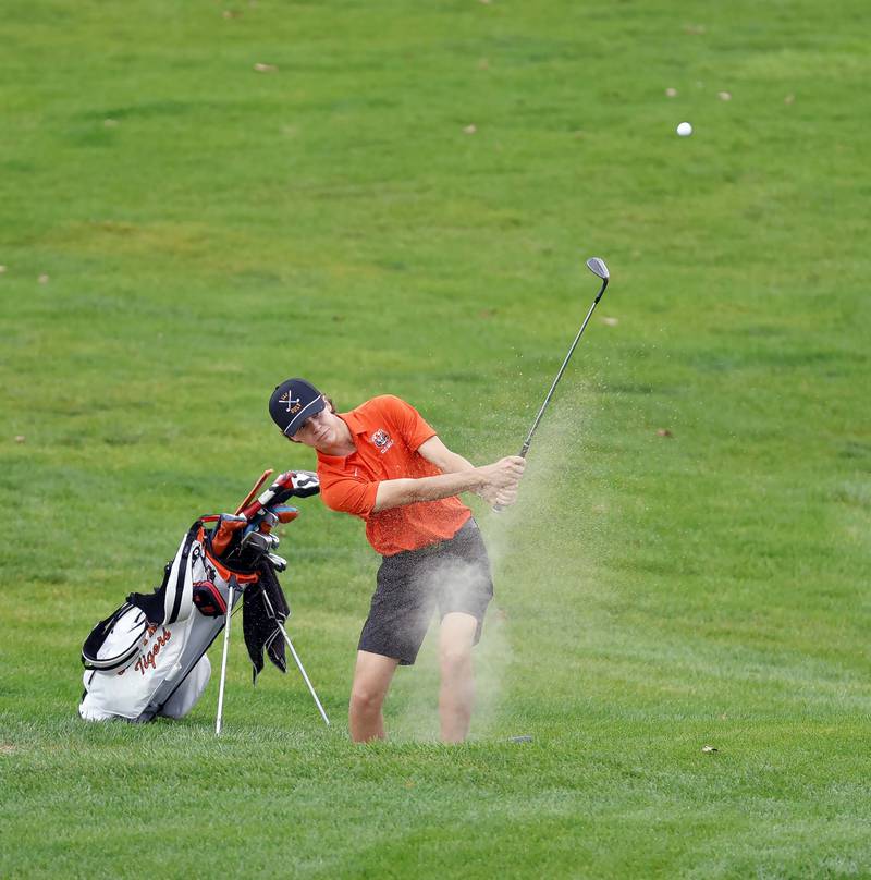 Asher Johnson of Crystal Lake Central chips to the green from a bunker during the Dundee-Crown Charger Invite Saturday, Sept. 20, 2025 at Randall Oaks Golf Club in West Dundee.
