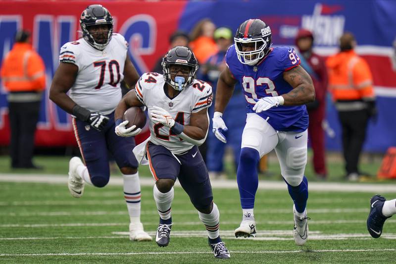 Chicago Bears running back Khalil Herbert (24) runs the ball against the New York Giants during the second quarter of an NFL football game, Sunday, Oct. 2, 2022, in East Rutherford, N.J. (AP Photo/Seth Wenig)