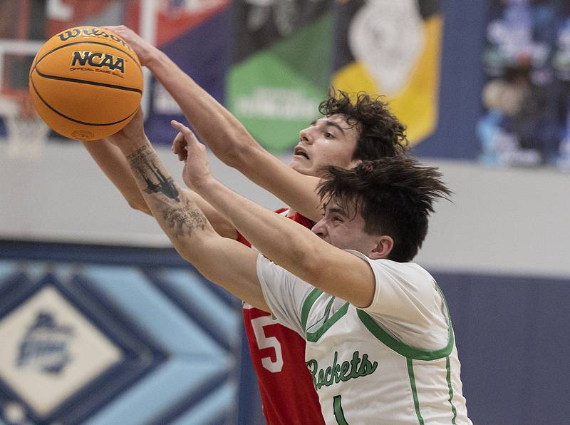 Oregon’s Benito Olalde and Rock Falls’ Austin Castaneda reach for a ball Wednesday, Feb. 26, 2025, at the Class 2A Regional semifinal at Bureau Valley High School.