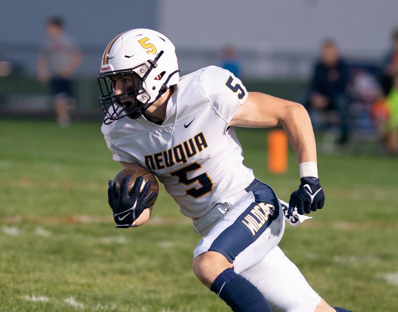 Neuqua Valley's Grant Larkin (5) returns a kickoff against Oswego during a football game at Oswego High School on Friday, Aug 26, 2022.