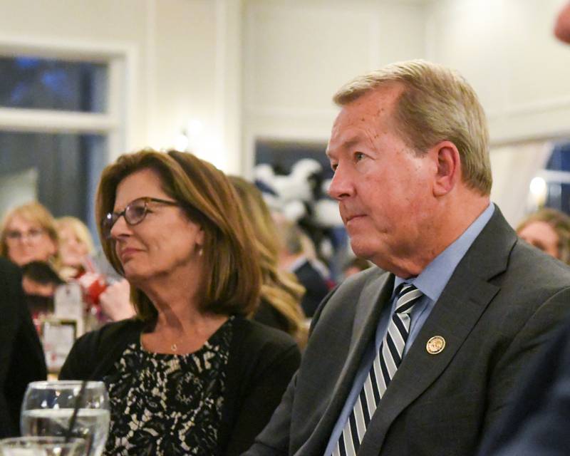 State Sen. Don DeWitte and his wife Diane DeWitte listen to Charlie Murphy, who was last year’s Charlemagne Award winner, speak about Don during the St. Charles Area Chamber of Commerce awards dinner Friday May 1, 2026, held at Royal Fox Country Club in St. Charles.