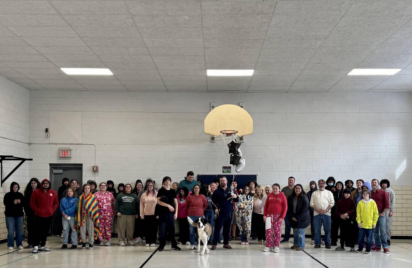 SRO Brian Zebron and Haven with students, faculty and staff after being surprised for School Resource Officer Appreciation Day on Feb. 15, 2025.