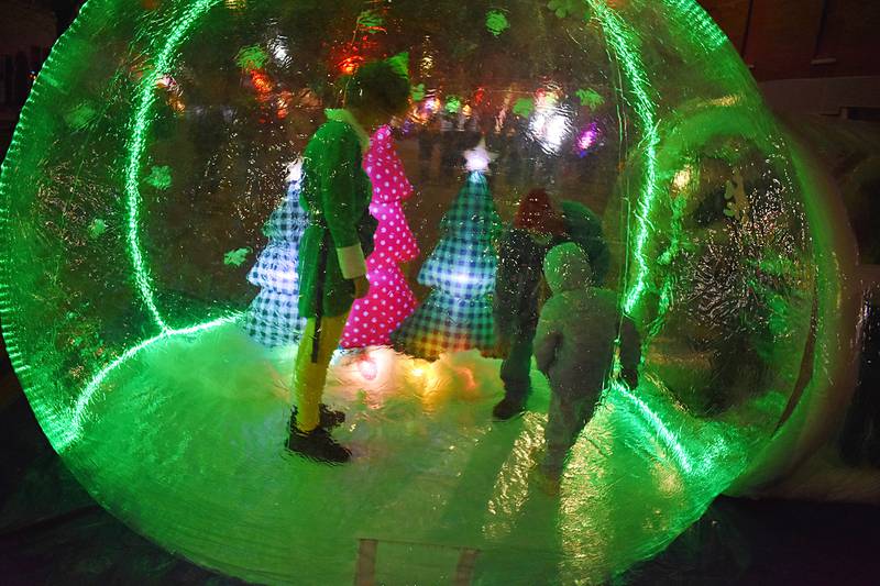Buddy the Elf greets visitors inside an inflatable ornament during Rock Falls’ Hometown Holiday Christmas Walk Friday, Nov. 21, 2025.
