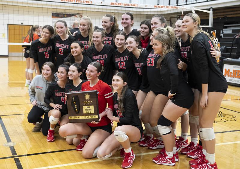 The Huntley varsity girls volleyball team celebrates their win against Libertyville during the Class 4A Sectional girls volleyball final on Thursday, November 7, 2024 at McHenry High School. Ryan Rayburn for Shaw Local