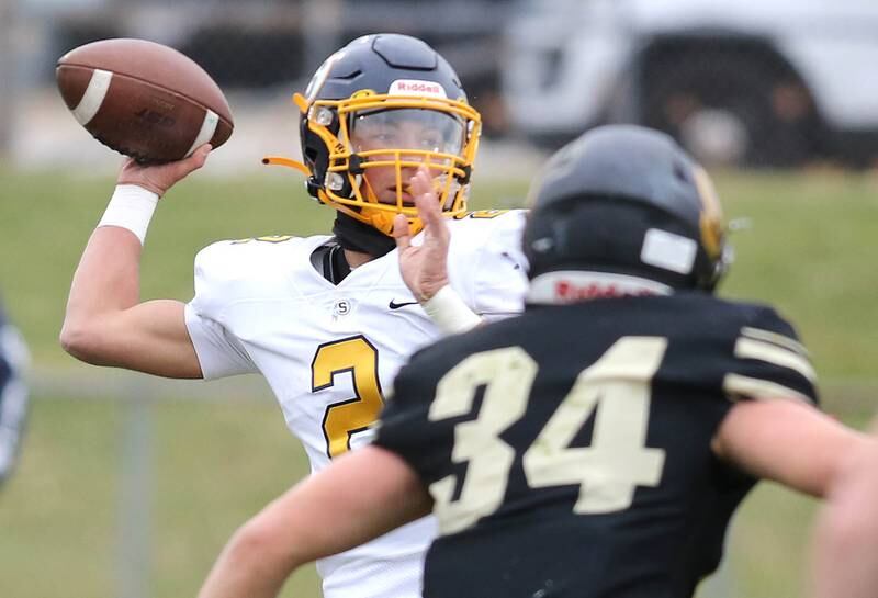 Sterling's JP Schilling fires a pass over Sycamore's Joey Puleo during their Class 5A state playoff game Saturday, Nov. 12, 2022, at Sycamore High School.