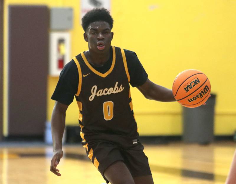 Jacobs’ Samson Averehi moves the ball against Grayslake Central in varsity boys basketball Hinkle Holiday Classic action on Tuesday, Dec. 23, 2025, at Jacobs High School in Algonquin.
