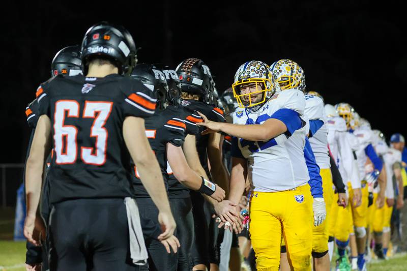 Players of Galva congratulate players of Flanagan Cornell Woodland after game on Friday, October 25, 2024 at Flanagan High School in Flanagan.