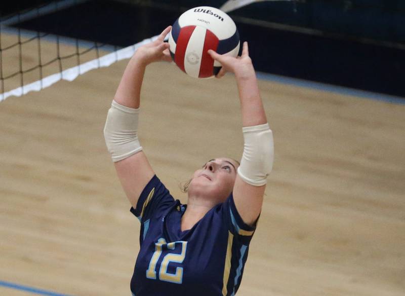 Marquette's Kinley Rick sets the ball in the air against St. Bede on Thursday, Sept. 4, 2025 at Bader Gym.
