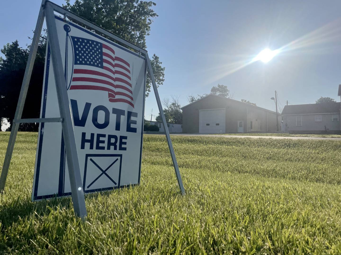 The sun rises over a "Vote Here" sign outside the Moose Lodge during the Primary Election on Tuesday, June 28, 2022 in Princeton.
