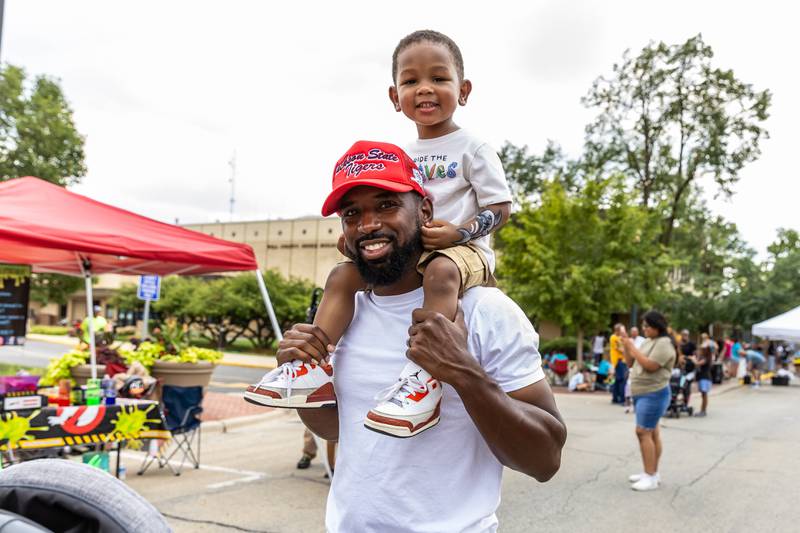 Joliet residents Steve and Shai Poston enjoy Kidz Fest in Joliet on Aug. 3, 2024.