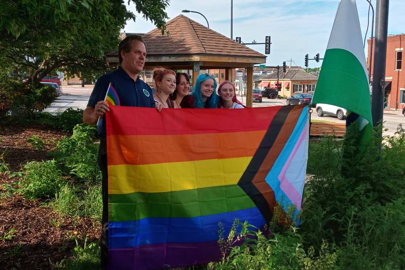 Geneva Mayor Kevin Burns prepares to raise the rainbow flag for Pride Month Wednesday with the assistance of four girls who will be freshman at Geneva High School this fall: Evan, they/she; Beau, any pronoun; Sophie, any pronoun; and Abby, she/her.