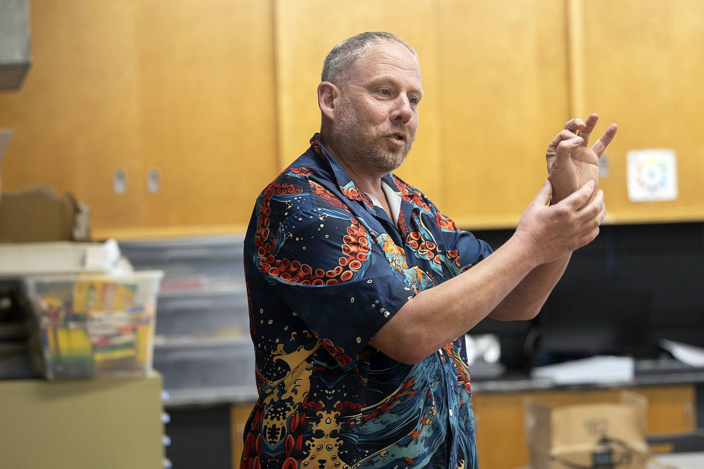 Sterling Challand Middle School art teacher Scott James teaches a technique on shading to his 6th grade students.