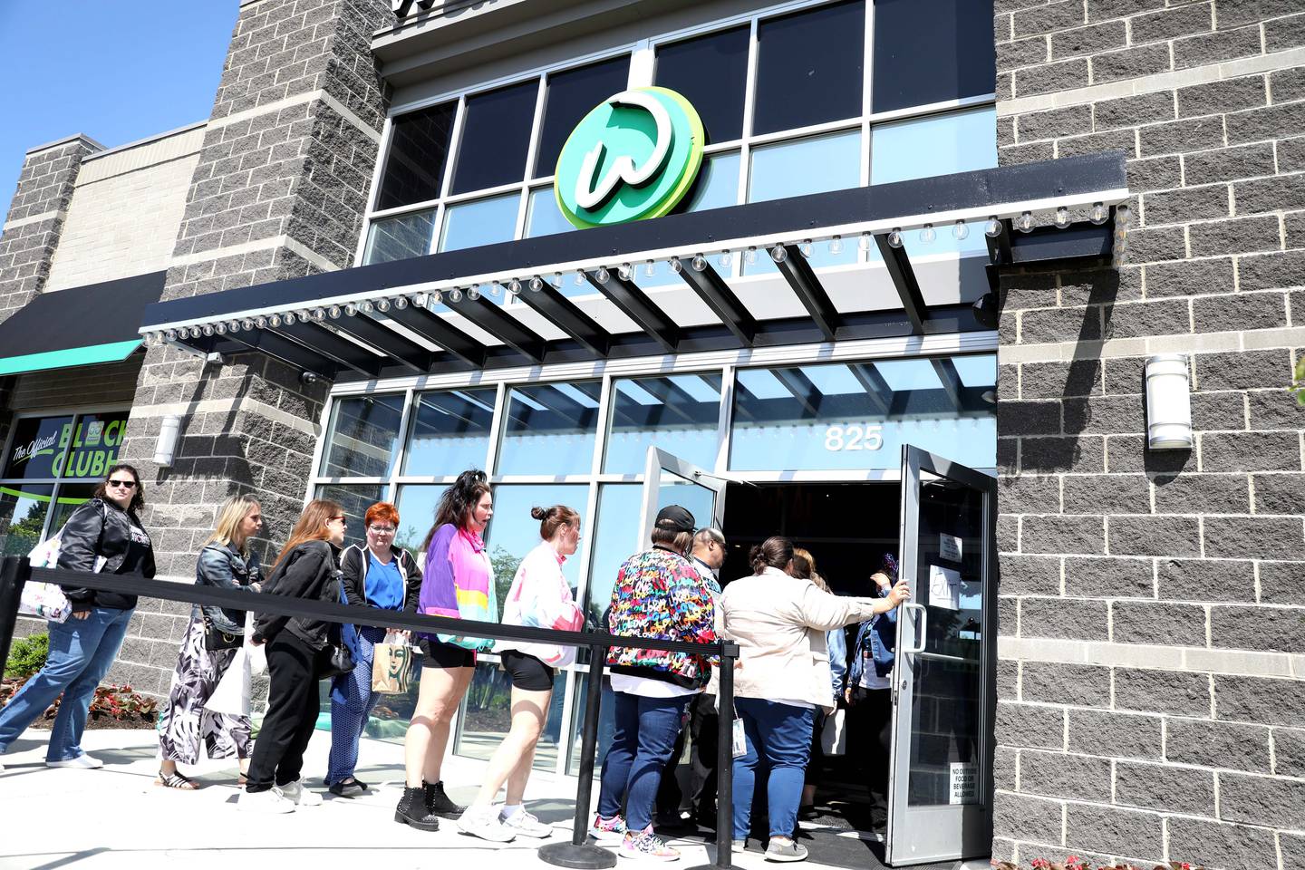 Hundreds of Donnie Wahlberg and New Kids on the Block fans wait outside Wahlburgers in St. Charles for a "WahlCon" pre-party on Thursday, May 25, 2023.