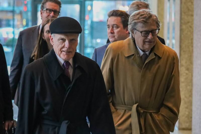 Former House Speaker Michael Madigan exits the Dirksen Federal Courthouse Wednesday with his former law partner Vincent “Bud” Getzendanner and others after the conclusion of his federal corruption trial. The case is now in the jury’s hands.
