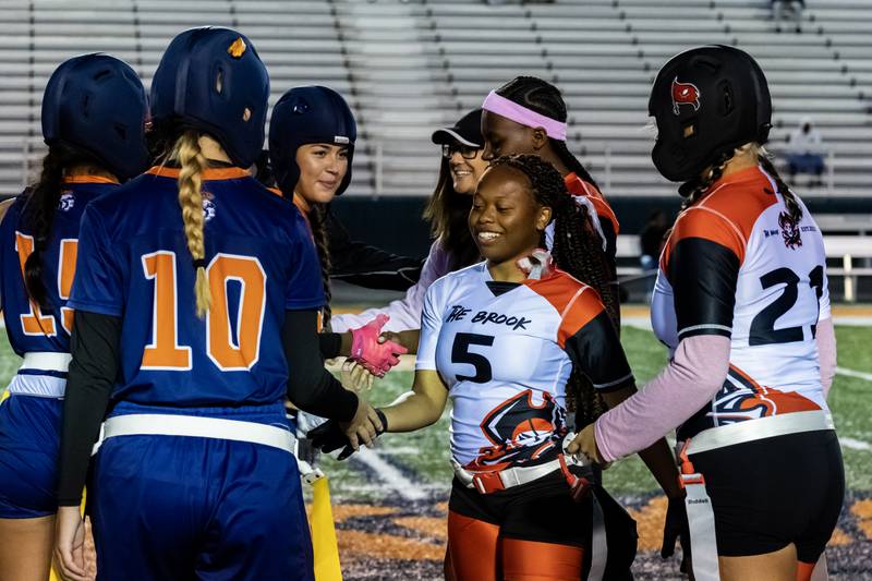 The captains from Romeoville and Bolingbrook shake hands prior to a varsity flag football Romeoville Regional semifinal game at Romeoville on Oct. 7, 2025.