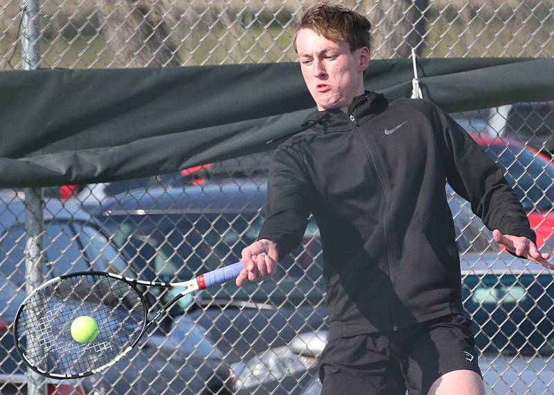 Ottawa's Adam Gross plays tennis against Morris on Tuesday, March 28, 2023 at Ottawa High School.