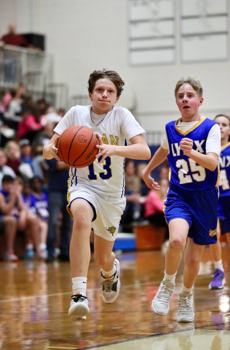 Logan seventh-grader Dominic Strouss takes in a layup against LaSalle Lincoln on Fight like Erin Night Tuesday at Prouty Gym.