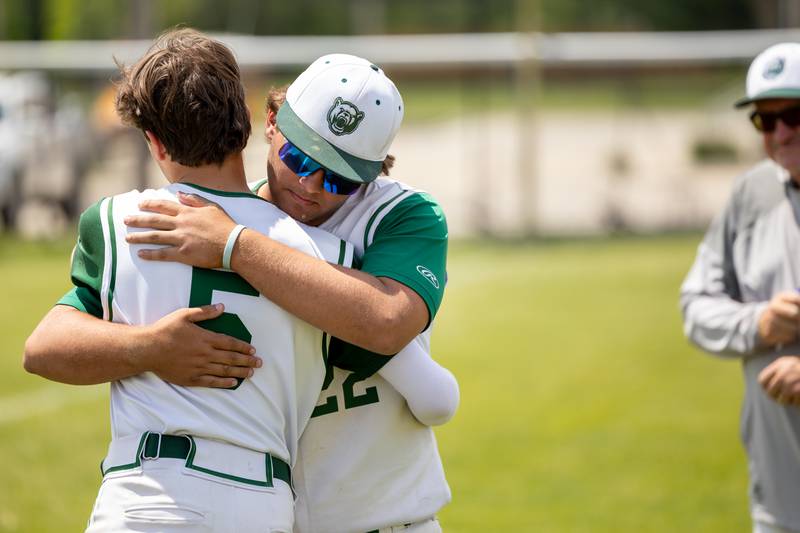 (5) Stuart McGunnigal of St. Bede hugs teammate (22) Alan Spencer after loss on Saturday, May 24, 2025 at Stark County High School in Toulon.