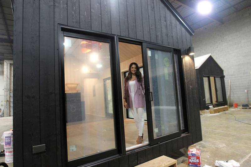 Anisha Seltenright, member, chief marketing officer, stands in the doorway of the Milla Long, a prefabricated tiny home with 456 square ft., without a loft, at the Prefab Pads LLC factory in Waukegan on July 17th, 2023. The tiny home was under construction for a resort project in Stowe, Vermont.
Image by Candace H. Johnson for Shaw Local News Network
