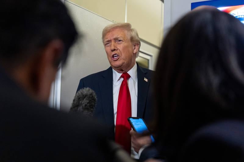 President Donald Trump speaks with reporters while in flight on Air Force One from Joint Base Andrews to his Mar-a-Lago estate in Palm Beach, Fla., Tuesday, Nov. 25, 2025. (AP Photo/Alex Brandon)
