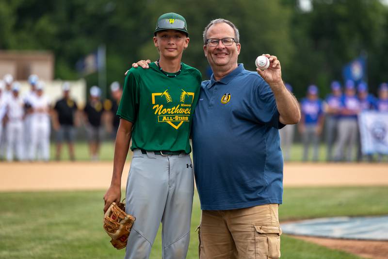 (left to right) Joey Wilson and Peru Mayor, Ken Kolowski pose for photo after the first pitch at the Central Region Tournament, opening Ceremony on Friday, July 11, 2025 at Washington Park in Peru.