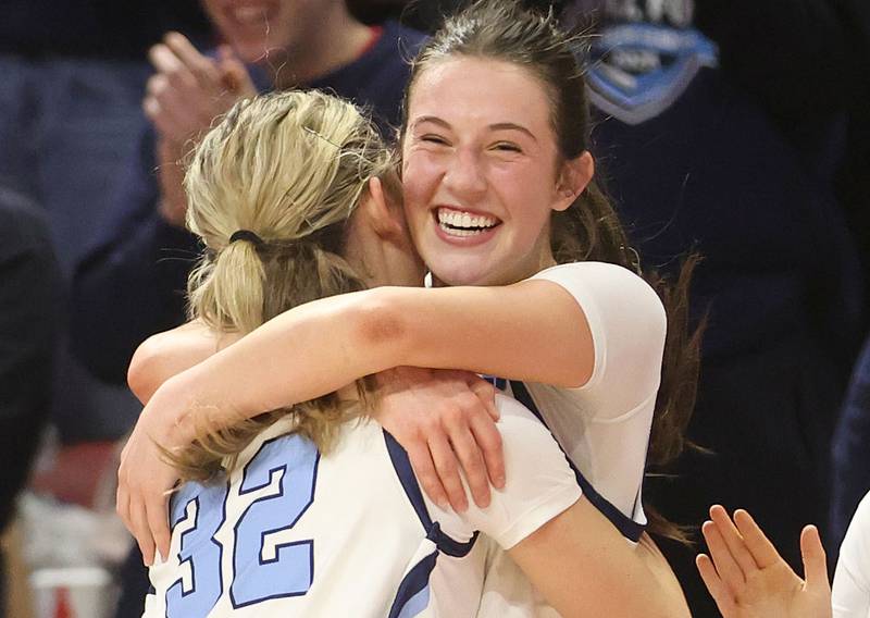 Nazareth's Sophia Towne hugs teammate Stella Sakalas during the Class 4A State girls basketball championship game on Saturday, March 7, 2026 at CEFCU Arena in Normal.